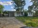 Charming single story home with a carport and front yard, offering comfort and convenience at 6136 Holiday Blvd, Forest Park, GA 30297