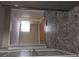 View of the hallway and entrance, featuring hard surface floors, leading to additional rooms at 6136 Holiday Blvd, Forest Park, GA 30297