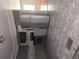 Modern kitchen with gray cabinets and stainless steel appliances, offering a stylish cooking space at 6136 Holiday Blvd, Forest Park, GA 30297