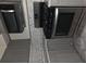 Kitchen with stainless steel appliances, modern gray cabinets and mosaic backsplash at 6136 Holiday Blvd, Forest Park, GA 30297