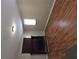 Bright living area with wood floors, skylight, and brick fireplace, providing warmth and charm at 6136 Holiday Blvd, Forest Park, GA 30297