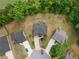 Expansive aerial view of property showcasing landscaping, mature trees, and cul-de-sac street at 114 Brookstone Dr, Carrollton, GA 30116
