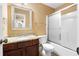 A full bathroom with granite counters and a shower and tub combo with glass doors at 114 Brookstone Dr, Carrollton, GA 30116