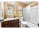 A full bathroom with granite counters and a shower and tub combo with glass doors at 114 Brookstone Dr, Carrollton, GA 30116