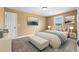 A neutral bedroom with a queen bed and bench at 114 Brookstone Dr, Carrollton, GA 30116