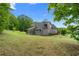 The well-maintained home boasts a spacious backyard and charming covered porch at 114 Brookstone Dr, Carrollton, GA 30116