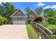 Attractive two-story home boasts stone detailing, a two-car garage, and meticulously maintained landscaping at 114 Brookstone Dr, Carrollton, GA 30116