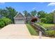 Charming two-story home with stone accents, a two-car garage, and landscaped front yard at 114 Brookstone Dr, Carrollton, GA 30116