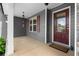 Charming front porch features gray siding, stone accents, and a red front door at 114 Brookstone Dr, Carrollton, GA 30116