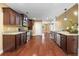 Spacious kitchen features stainless steel appliances, granite countertops, hardwood floors, and lots of natural light at 114 Brookstone Dr, Carrollton, GA 30116