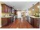 Eat-in kitchen with stainless steel appliances, granite countertops, hardwood floors, and lots of natural light at 114 Brookstone Dr, Carrollton, GA 30116
