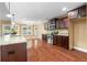 Spacious kitchen features wood floors, granite countertops, stainless steel appliances, and recessed lighting at 114 Brookstone Dr, Carrollton, GA 30116