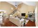 Living area features tall ceilings, a fireplace with stone surround, and a staircase to the second floor at 114 Brookstone Dr, Carrollton, GA 30116