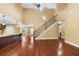 A living room with hardwood floors, a staircase, and an open layout, offering a spacious and inviting atmosphere at 114 Brookstone Dr, Carrollton, GA 30116
