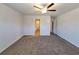 Spacious carpeted bedroom with ample natural light, offering a comfortable and inviting retreat for relaxation at 115 Deer Xing, Temple, GA 30179