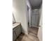 Bathroom featuring a walk-in shower and a vanity with granite countertop at 123 Deer Xing, Temple, GA 30179