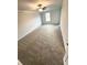 Bright bedroom with carpet flooring, neutral paint and one large window at 123 Deer Xing, Temple, GA 30179