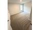 Cozy bedroom with soft carpeting, a bright window, and ample closet space at 123 Deer Xing, Temple, GA 30179