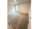 Cozy bedroom with soft carpeting, a bright window, and ample closet space at 123 Deer Xing, Temple, GA 30179