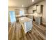 Beautiful kitchen with a gray island, ample counter space, and stainless steel appliances at 123 Deer Xing, Temple, GA 30179