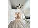 Spacious living area boasting high ceilings, modern fireplace, and seamless flow into kitchen at 123 Deer Xing, Temple, GA 30179