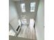 High-ceilinged living room with lots of light, a fireplace, and wood-look flooring at 123 Deer Xing, Temple, GA 30179