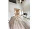 Open-concept living room featuring soaring ceilings, fireplace, and wood-look flooring at 123 Deer Xing, Temple, GA 30179