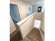 Carpeted staircase with white banister leading to the next level of the home at 123 Deer Xing, Temple, GA 30179