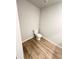 Powder room with wood-style flooring and a toilet at 528 Earnest Ln, Temple, GA 30179