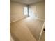 Bedroom with neutral walls and carpeting, and a double window at 528 Earnest Ln, Temple, GA 30179