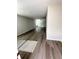 Bright living room showcasing new wood flooring and abundant natural light from the large windows at 528 Earnest Ln, Temple, GA 30179