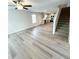 Open-concept living room and kitchen area, highlighting new wood flooring and a staircase at 528 Earnest Ln, Temple, GA 30179