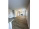 Open-concept living room with fireplace and light wood-look floors at 100 Deer Xing, Temple, GA 30179