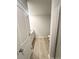 Bathroom view with a vanity, toilet, shower with a glass enclosure, and plank-style flooring at 131 Deer Xing, Temple, GA 30179