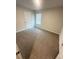 Cozy bedroom with neutral carpet, a bright window and fresh neutral paint at 131 Deer Xing, Temple, GA 30179