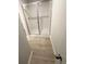Modern bathroom featuring a glass-enclosed shower with neutral, plank-style flooring at 131 Deer Xing, Temple, GA 30179