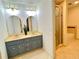 Well-lit bathroom with double vanity, modern fixtures, and a separate shower and tub at 1461 Fox Forest Sw Ter, Lilburn, GA 30047
