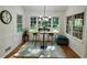 Cozy breakfast nook filled with natural light, featuring an inviting table and seating at 1461 Fox Forest Sw Ter, Lilburn, GA 30047