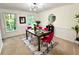 Elegant dining room with modern lighting, stylish decor, and a comfortable seating arrangement at 1461 Fox Forest Sw Ter, Lilburn, GA 30047
