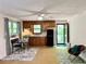Cozy living area features a kitchenette, dining table, and access to the exterior at 1461 Fox Forest Sw Ter, Lilburn, GA 30047