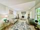 Bright living room showcasing modern decor, large windows, and a comfortable seating arrangement at 1461 Fox Forest Sw Ter, Lilburn, GA 30047
