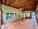 Spacious patio with wood ceiling and two ceiling fans at 1461 Fox Forest Sw Ter, Lilburn, GA 30047