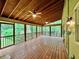 Screened-in porch with wood floors and ceiling, perfect for enjoying the outdoors at 1461 Fox Forest Sw Ter, Lilburn, GA 30047