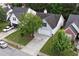 Aerial view of a charming home with a lush yard in a well-maintained neighborhood at 285 Kentshire Pl, Lawrenceville, GA 30044