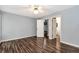 Comfortable bedroom boasts wood floors and offers ample natural light from multiple windows at 285 Kentshire Pl, Lawrenceville, GA 30044