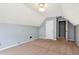 Spacious carpeted bedroom features a patterned ceiling, closet, and light gray walls at 285 Kentshire Pl, Lawrenceville, GA 30044