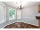 Breakfast nook with tile floors, a chandelier, and large windows at 285 Kentshire Pl, Lawrenceville, GA 30044