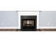 Close-up of the black fireplace at 285 Kentshire Pl, Lawrenceville, GA 30044