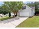 Charming home featuring a two-car garage and well-maintained landscaping at 285 Kentshire Pl, Lawrenceville, GA 30044