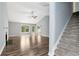 Spacious living room with wood-look floors and a staircase at 285 Kentshire Pl, Lawrenceville, GA 30044